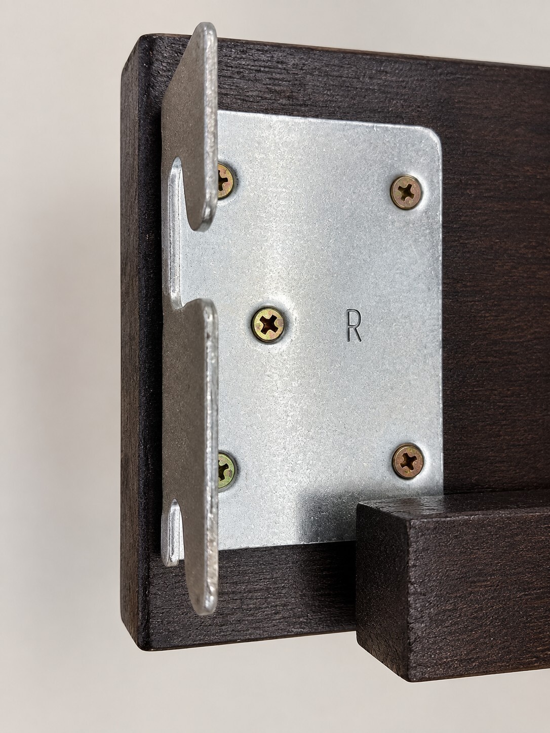 Dillon wooden bunk bed rail with metal bracket showing the intentional 1/8-inch gap