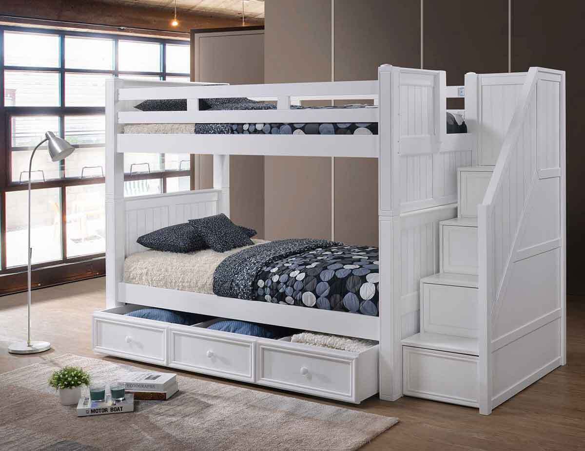 White adult bunk bed with staircase access and built-in storage drawers
